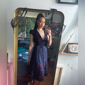 Cute navy wrap dress with red hearts pattern.